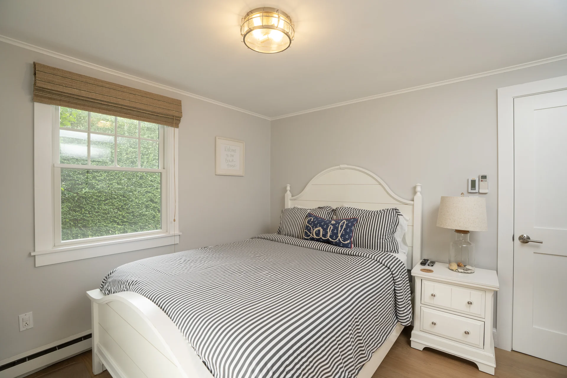 Guest bedroom with nautical decor in Nantucket renovation