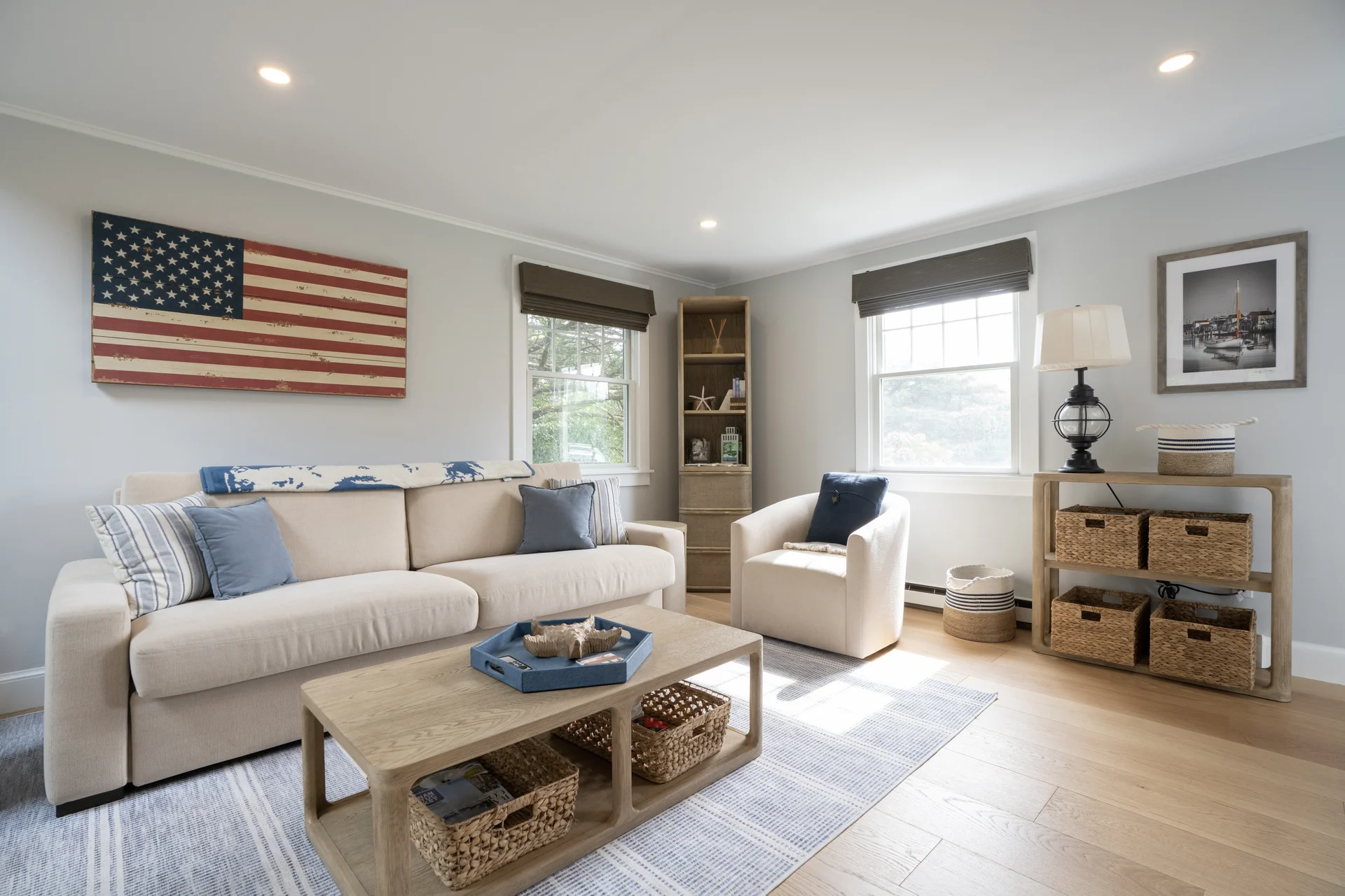 Living room with coastal decor in renovated Nantucket home