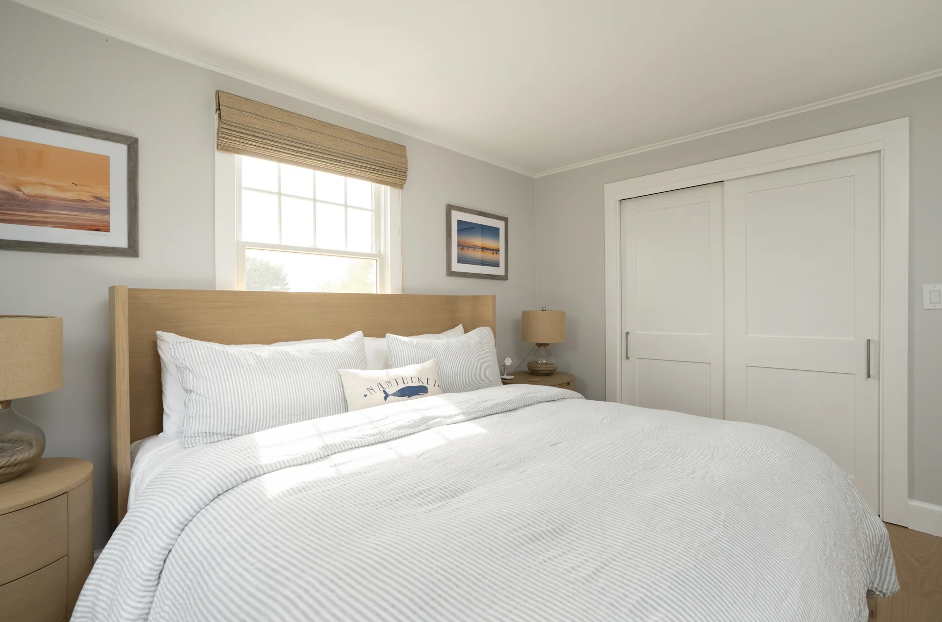 Master bedroom with coastal style decor in Nantucket renovation