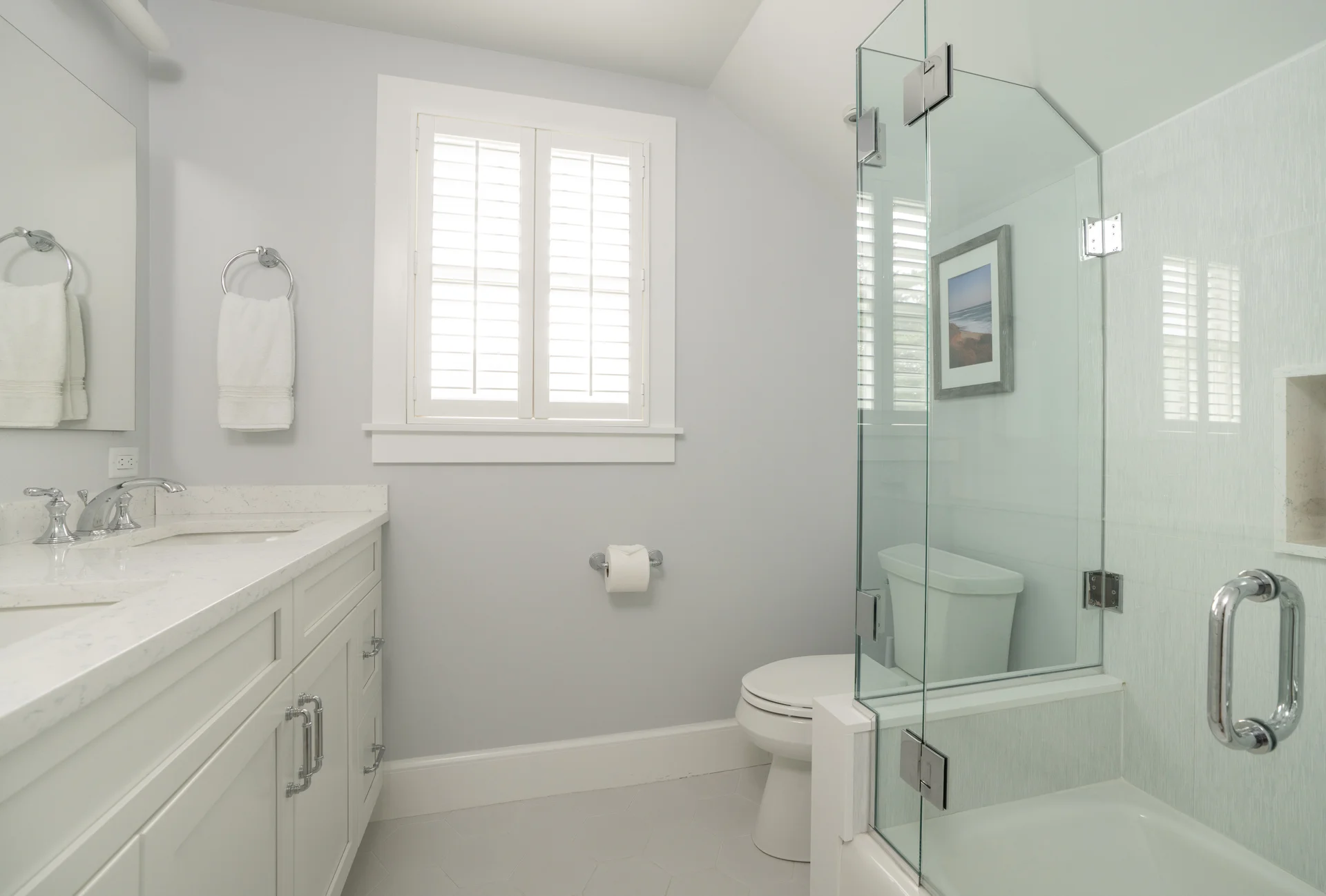 Modern bathroom with glass shower in Nantucket renovation