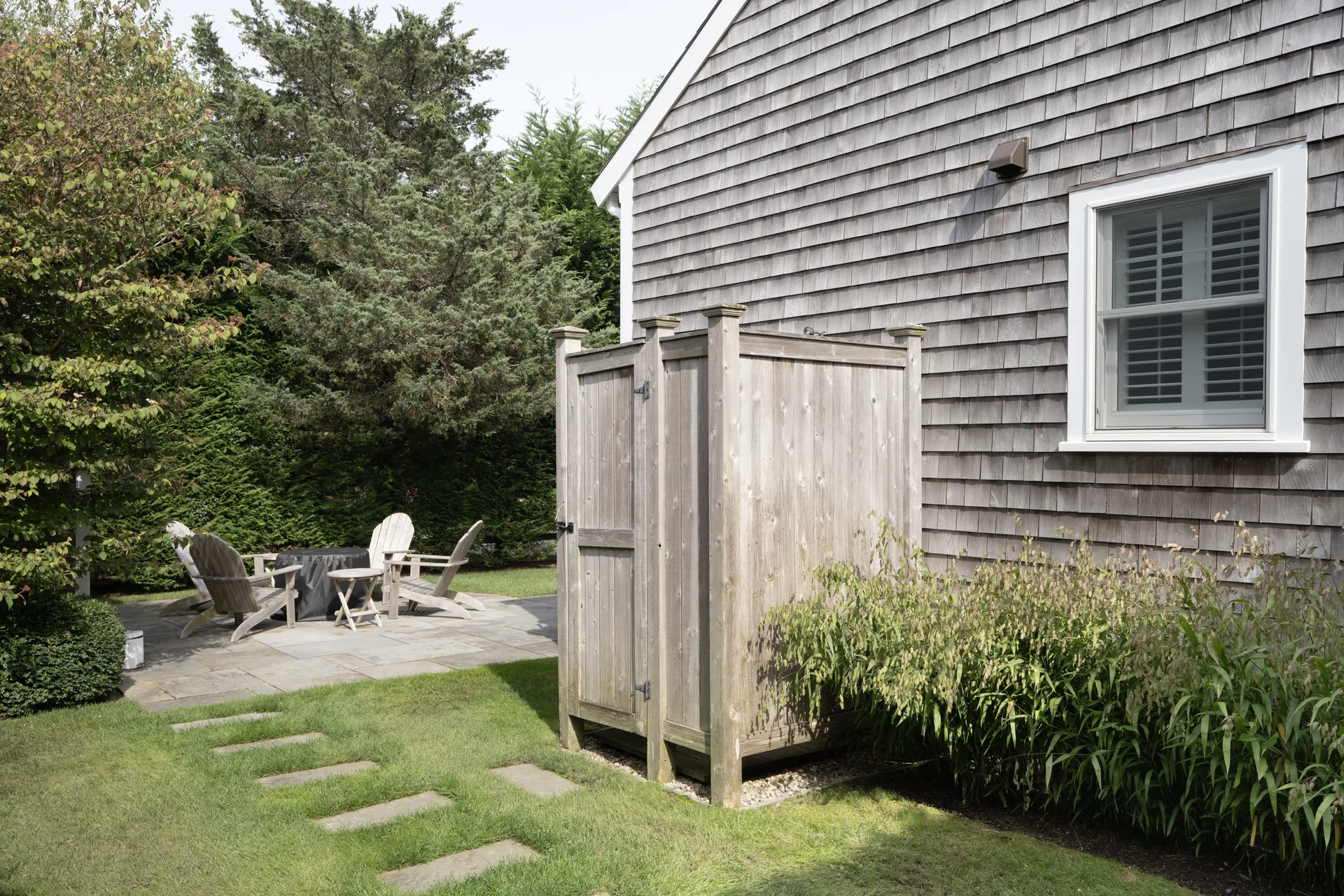 Outdoor shower with cedar siding in Nantucket renovation