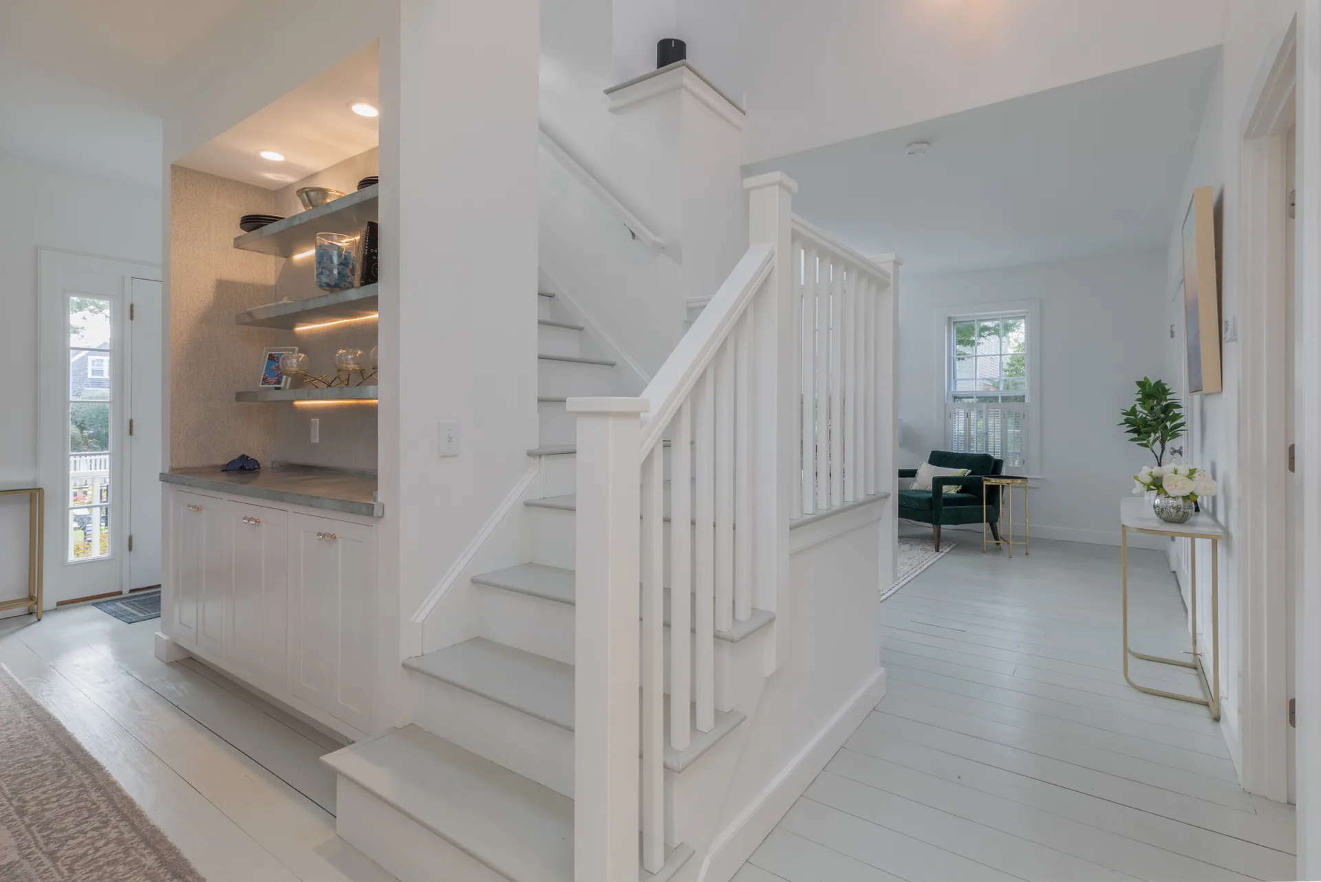 Interior entryway with new staircase and built-in shelving