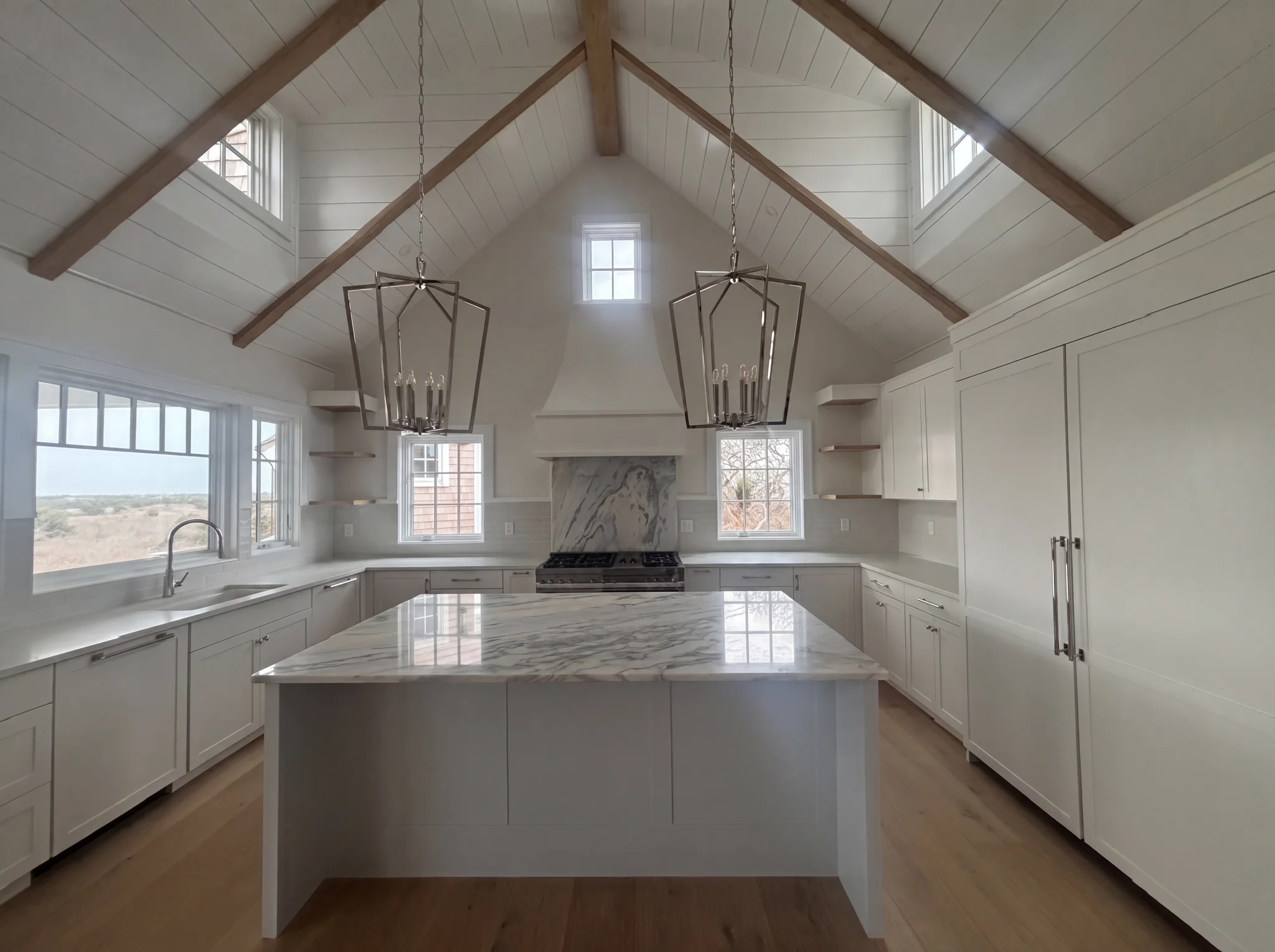 Custom kitchen with vaulted ceiling and island at North Pasture Lane in Nantucket