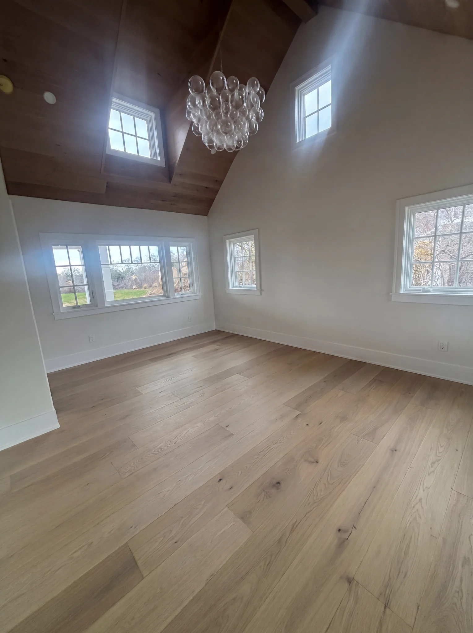 Primary bedroom with custom wood ceiling at the North Pasture Lane Project