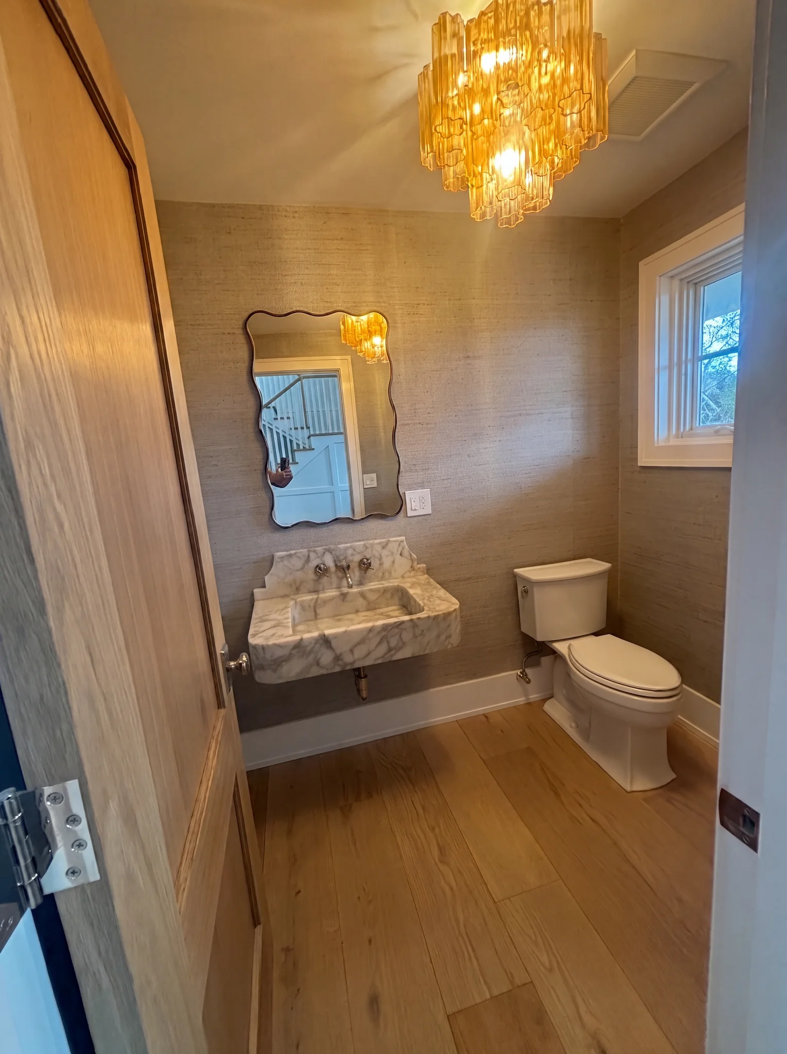 Powder room vanity and chandelier at North Pasture Lane